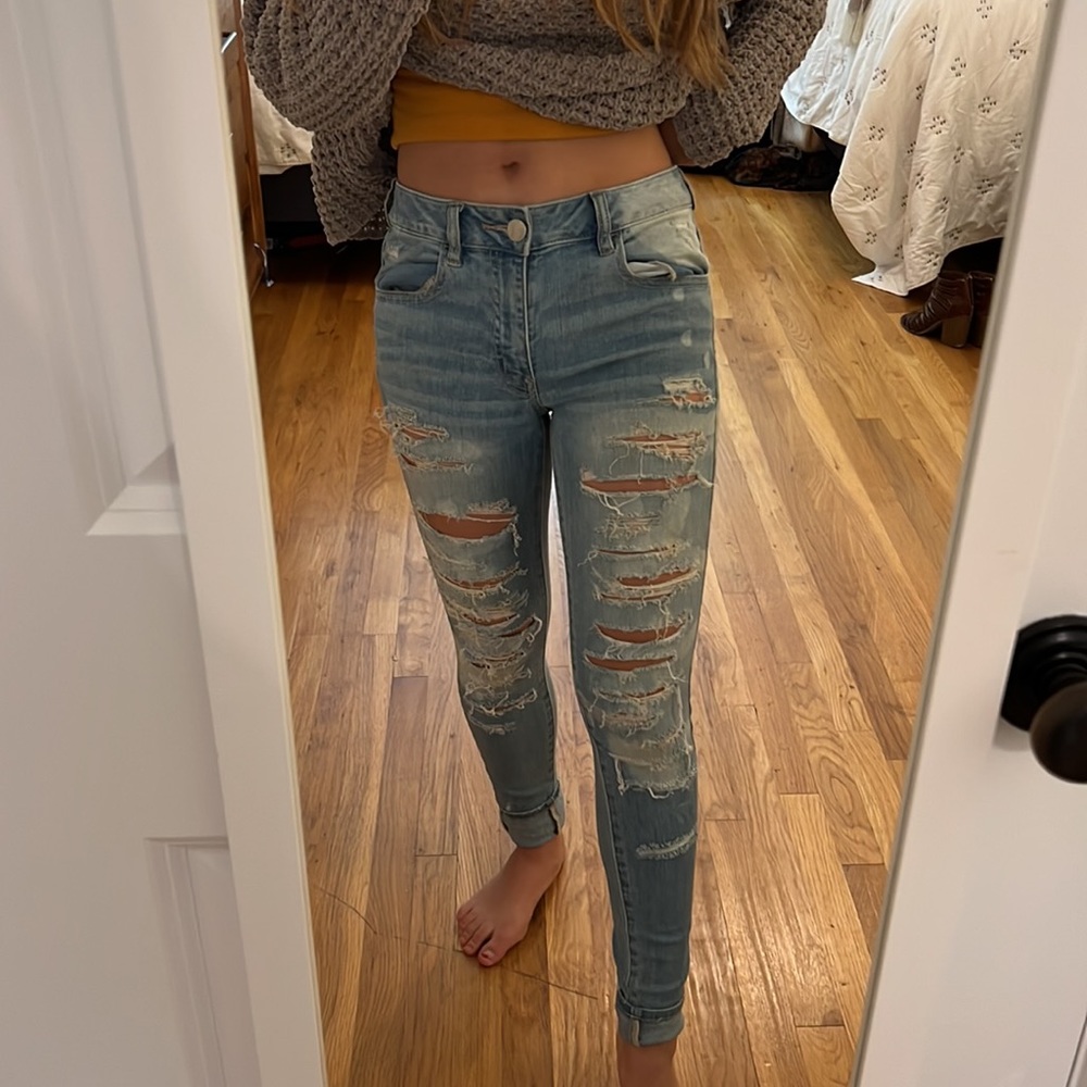 American Eagle Light-wash High-rise sporadically-bleached ripped jeans